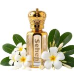 Luxury champa attar perfume oil with plumeria floral notes, alcohol free long lasting fragrance in India